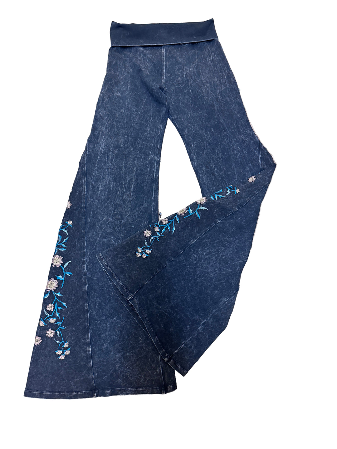 Black denim fabric with floral embroidery on a white background