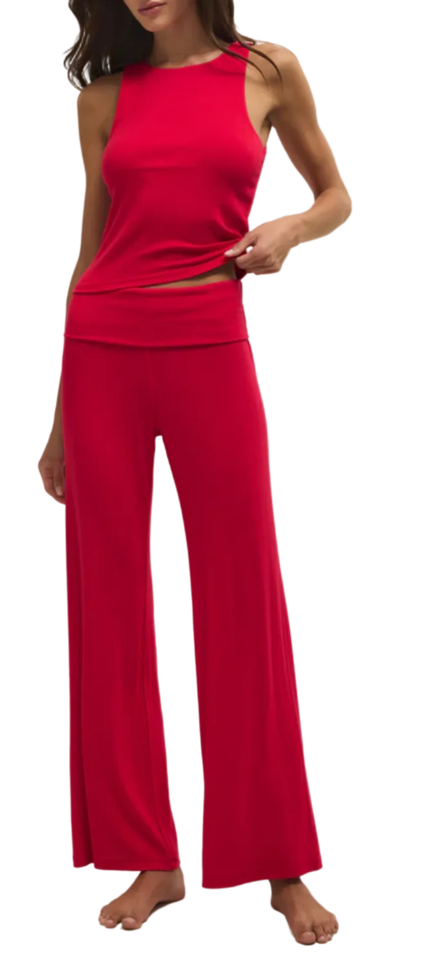 Woman wearing a red outfit on a plain background