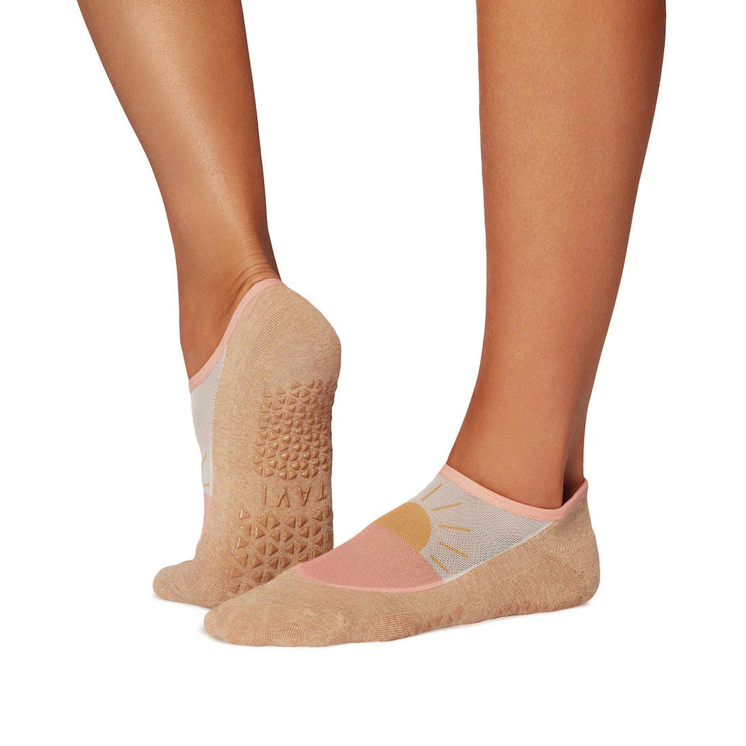 Beige socks with textured sole and floral design on a white background