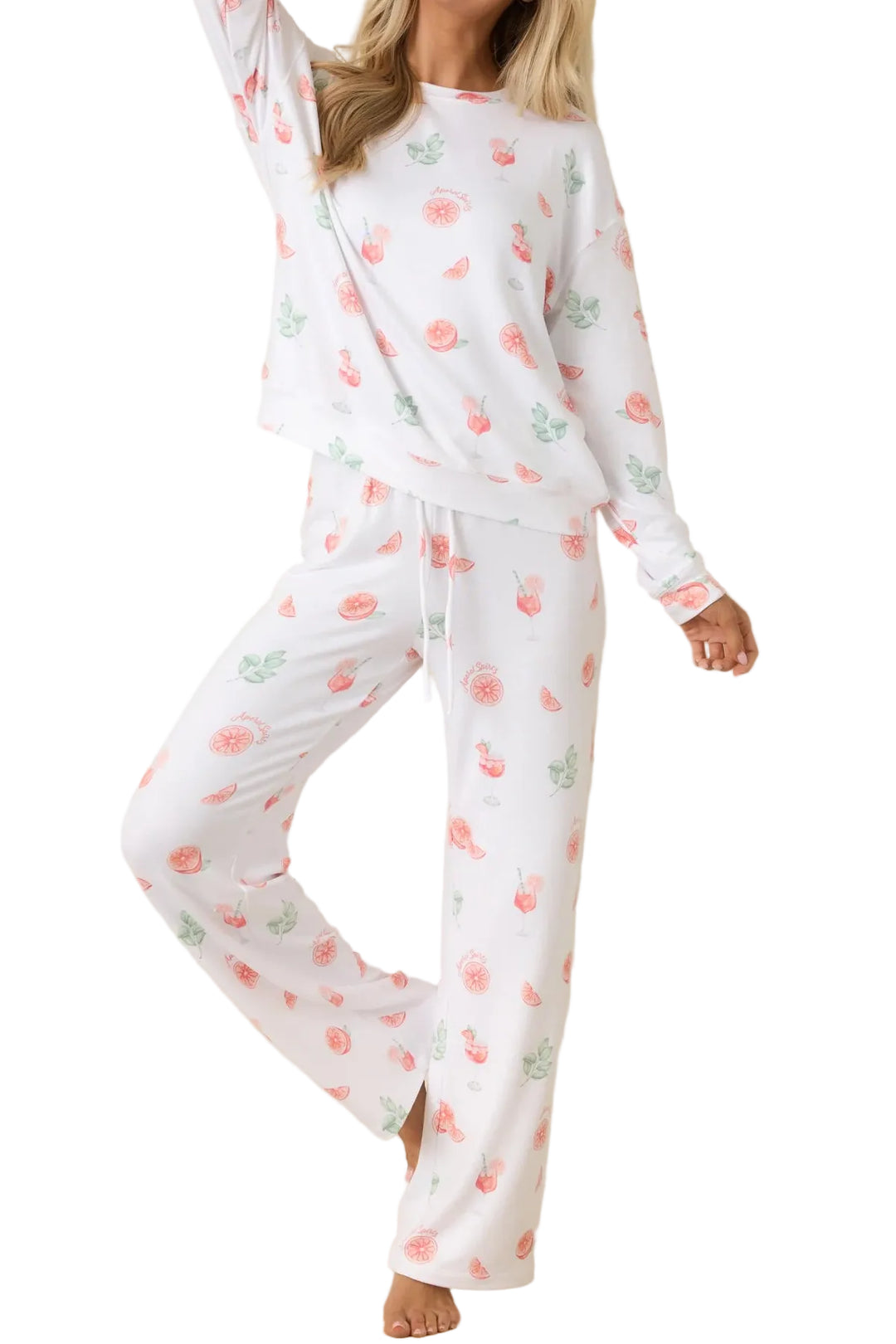 Woman wearing a white pajama set with floral pattern on a beige background